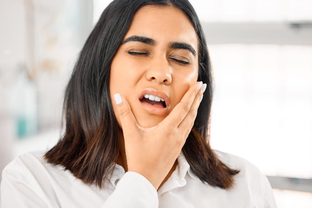 Woman, toothache and mouth pain in home for cavity, tooth infection or dental emergency